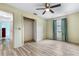 Bright bedroom with laminate flooring, standard-sized closet, and a window providing natural light at 3242 Nocturne Rd, Venice, FL 34293