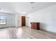 Inviting living room with updated floors, a decorative cabinet, and natural light at 3242 Nocturne Rd, Venice, FL 34293