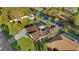 Aerial view of home featuring a private canal, screened pool, and lush landscaping at 372 Cory St, Port Charlotte, FL 33953