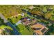 Aerial view of home featuring the mature landscaping, long driveway and waterfront backyard at 372 Cory St, Port Charlotte, FL 33953