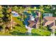 Aerial view of home highlighting the mature landscaping, long driveway and waterfront backyard at 372 Cory St, Port Charlotte, FL 33953