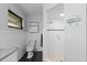 Bright bathroom with updated features including shower, toilet and black flooring at 372 Cory St, Port Charlotte, FL 33953