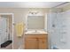 Bathroom features a vanity with a mirror, a shower with glass door, and tiled floors at 372 Cory St, Port Charlotte, FL 33953
