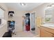The bathroom and closet area has ample storage space and tiled floors at 372 Cory St, Port Charlotte, FL 33953