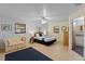 Bright bedroom with a full bed, two windows and a cozy sitting area and doorway to bathroom at 372 Cory St, Port Charlotte, FL 33953