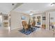Cozy dining area features a charming wicker table set with a blue patterned rug and natural lighting at 372 Cory St, Port Charlotte, FL 33953