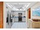 Spacious kitchen featuring modern stainless steel appliances, light grey cabinetry, and ample counter space at 372 Cory St, Port Charlotte, FL 33953