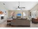 Spacious living room features a decorative fireplace, tile flooring, and neutral colors at 372 Cory St, Port Charlotte, FL 33953
