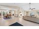 Bright and open living room with a cozy fireplace and comfortable seating arrangements at 372 Cory St, Port Charlotte, FL 33953