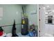 Utility room with essential systems and ample storage with easy access to kitchen at 372 Cory St, Port Charlotte, FL 33953