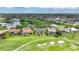 Homes with screened-in pools line a vibrant golf course community with lush green lawns and ponds at 3724 Bordeaux Dr, Punta Gorda, FL 33950