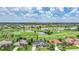 Stunning aerial view capturing a lush golf course community with serene lakes and well-manicured lawns at 3724 Bordeaux Dr, Punta Gorda, FL 33950
