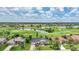 Breathtaking aerial view of the property showcasing a scenic golf course and multiple water features at 3724 Bordeaux Dr, Punta Gorda, FL 33950