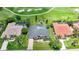 Aerial view of home on the golf course with a pool and a dark tile roof at 3724 Bordeaux Dr, Punta Gorda, FL 33950