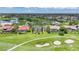 Homes with screened-in pools line a vibrant golf course community with lush green lawns at 3724 Bordeaux Dr, Punta Gorda, FL 33950
