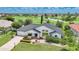 Beautiful aerial view of the home with a golf course in the background at 3724 Bordeaux Dr, Punta Gorda, FL 33950