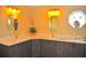 Bathroom featuring double sinks, grey cabinets, octagonal window, and bright lighting at 3724 Bordeaux Dr, Punta Gorda, FL 33950