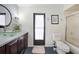 Bathroom with tiled wall, glass sink, and shower at 3724 Bordeaux Dr, Punta Gorda, FL 33950
