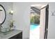Stylish bathroom with vessel sink, modern faucet, and pool view at 3724 Bordeaux Dr, Punta Gorda, FL 33950