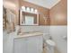 Neutral half bathroom with white wainscoting and vanity at 3724 Bordeaux Dr, Punta Gorda, FL 33950