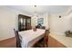 Elegant dining room featuring a crystal chandelier, china cabinet, and seating for six at 3724 Bordeaux Dr, Punta Gorda, FL 33950