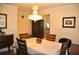 Well-lit dining room with wood floors, hutch and chandelier at 3724 Bordeaux Dr, Punta Gorda, FL 33950