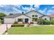 Charming single Gathering home with manicured lawn, flower beds, and dark tile roof at 3724 Bordeaux Dr, Punta Gorda, FL 33950