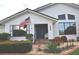 Charming single-Gathering home with manicured landscaping, a quaint front porch and patriotic flag at 3724 Bordeaux Dr, Punta Gorda, FL 33950