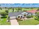 Charming home features a brick driveway, colorful landscaping and a view of the golf course at 3724 Bordeaux Dr, Punta Gorda, FL 33950