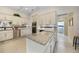 Modern kitchen with white cabinets, granite countertops, stainless steel appliances, and tiled backsplash at 3724 Bordeaux Dr, Punta Gorda, FL 33950