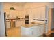 Spacious kitchen with a center island, white cabinets and stainless steel appliances at 3724 Bordeaux Dr, Punta Gorda, FL 33950