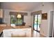 Bright kitchen featuring granite countertops, center island and an outdoor view of the pool at 3724 Bordeaux Dr, Punta Gorda, FL 33950