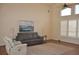 Spacious living room boasting vaulted ceilings, with clerestory windows, and a ceiling fan at 3724 Bordeaux Dr, Punta Gorda, FL 33950
