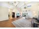 Open concept living room with hardwood floors, sliders to patio, and vaulted ceilings at 3724 Bordeaux Dr, Punta Gorda, FL 33950