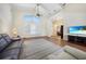 Vaulted ceiling, hardwood floors, shutters and furnishings in this expansive living room at 3724 Bordeaux Dr, Punta Gorda, FL 33950