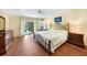 Spacious main bedroom with sliding glass doors to the screened-in lanai at 3724 Bordeaux Dr, Punta Gorda, FL 33950