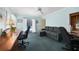A spacious office with a sleeper sofa and sliding doors to the pool area at 3724 Bordeaux Dr, Punta Gorda, FL 33950