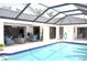 Outdoor patio area with cozy seating, modern decor, and access to the pool at 3724 Bordeaux Dr, Punta Gorda, FL 33950