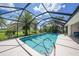 Enjoy this screened-in in-ground pool overlooking the landscaped backyard at 3724 Bordeaux Dr, Punta Gorda, FL 33950