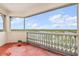 Balcony with white railings showcasing a scenic view of the city and building at 3730 Cadbury Cir # 616, Venice, FL 34293