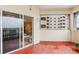 Balcony features sliding glass doors with an outdoor seating area and scenic views at 3730 Cadbury Cir # 616, Venice, FL 34293