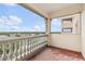 View of the city from a balcony with white railings and a covered ceiling at 3730 Cadbury Cir # 616, Venice, FL 34293