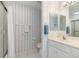 Bathroom featuring a glass shower, toilet, and single sink with a large mirror at 3730 Cadbury Cir # 616, Venice, FL 34293