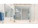 Bathroom featuring a large mirror, dual sinks, vanity, and walk-in shower at 3730 Cadbury Cir # 616, Venice, FL 34293