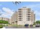 Luxury condo building with multiple stories, balconies, and well-maintained landscaping at 3730 Cadbury Cir # 616, Venice, FL 34293