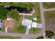 Bird's-eye view of a well-kept home and dock, revealing its location near a tranquil canal at 405 Ridgecrest Dr, Punta Gorda, FL 33982