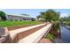 Large backyard with canal access and seawall and concrete patio at 405 Ridgecrest Dr, Punta Gorda, FL 33982
