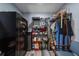Organized walk-in closet with shelving units, wire racks, storage containers, and a safe at 405 Ridgecrest Dr, Punta Gorda, FL 33982
