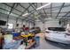 Spacious garage features two cars, multiple work benches and shelving at 405 Ridgecrest Dr, Punta Gorda, FL 33982