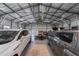 Spacious garage with two cars, multiple work benches and shelving at 405 Ridgecrest Dr, Punta Gorda, FL 33982